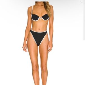 L space black bikini with white trim - such a cute fit. Large bottoms Medium top